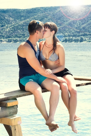 young kissing couple on the beachの写真素材