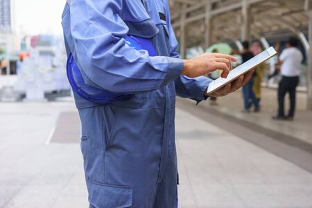 Mechanic is using a tablet.の写真素材