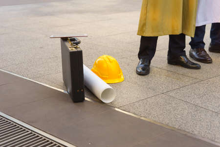 Arab's briefcase, blueprint, yellow helmet and tablet.の写真素材