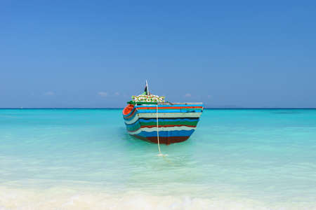 Thai traditional boat parked at Racha Island, Andaman Sea.の写真素材