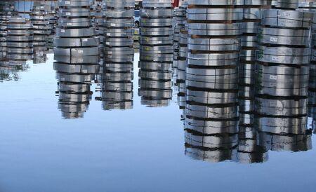 Steel metal rolls stored on a flooded patio 3の写真素材