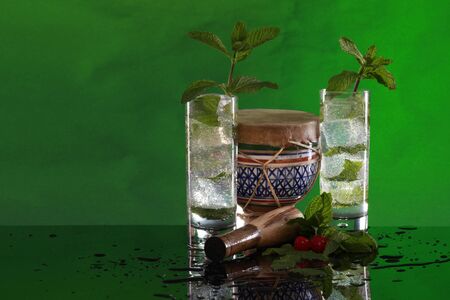 Mojitos with muddler and bongo incline room to the left