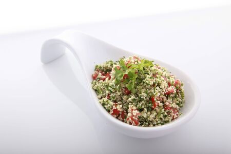 Tabouli, greek or arab salad containing parsley and bulgur wheatの写真素材