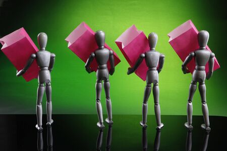 Silver dummies carrying gift bagsの写真素材