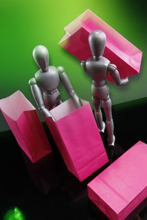Silver dummies carrying gift bagsの写真素材