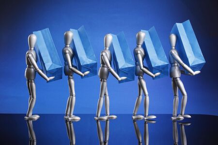 Silver dummies carrying gift bagsの写真素材