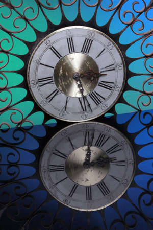 Decorative vintage clock framed with an iron radial structureの写真素材