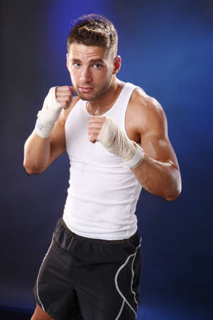 Toned boxer working with hand wraps