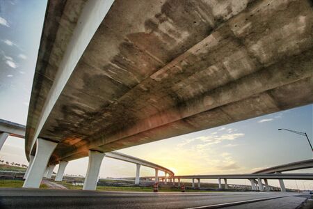 Grunge weathered texture under a freeway overpass at sunset