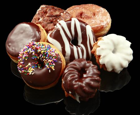 Assorted donuts on blackの写真素材