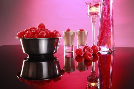 Cream liquor and raspberries in a romantic setting