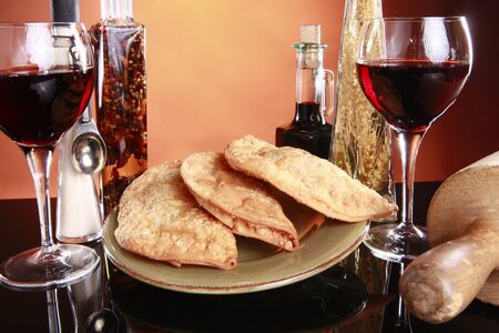 Deep fried empanadas, wine, and spices