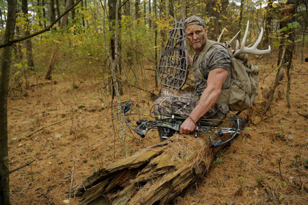 Bow hunter tracking prey