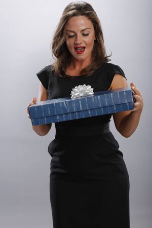 Young woman gets a giftの写真素材