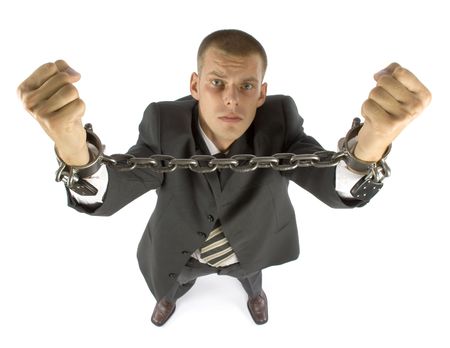 businessman with chains on his handsの写真素材