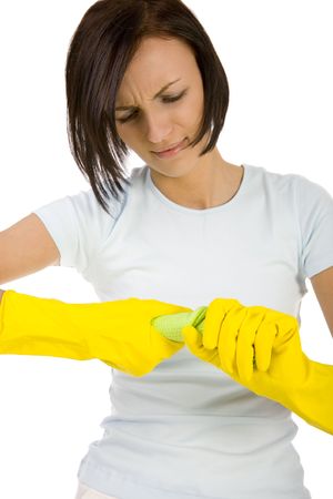 Young woan in yellow rubber gloves wring washcloth. Front view, white background.の写真素材
