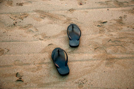 Sandals on on of the beautiful beaches on Koh Lanta island, Krabi, Thailandの写真素材