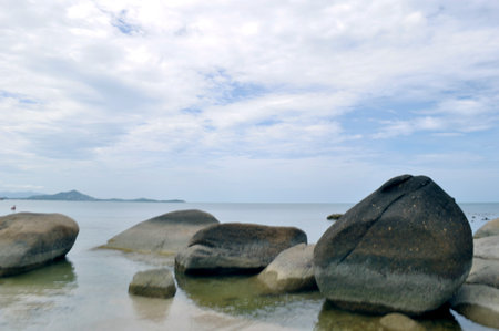 rocks and sea in the evening at Silver Beach in Koh Samui, Thailandの写真素材