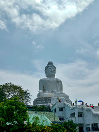 The Big Buddha Statue on Hilltop in Phuket, Thailand with Scenic Sky Backgroundの写真素材