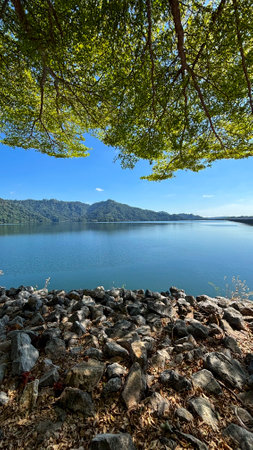 Beautiful landscape view of lake and forest in the morning, Khun Dan Prakarnchon Dam Reservoir and Scenic View in Nakhon Nayok, Thailandの写真素材