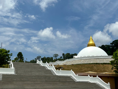 Thai temple with blue sky and white cloud background,Wat Luang Pu Supa Temple in Phuket, Thailandの写真素材