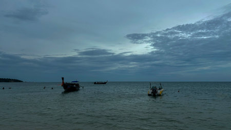 Fishing boat on Lamai beach in the evening at Koh Samui, Thailandの写真素材