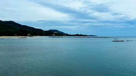 Scenic Coastal Landscape of Hua Thanon Beach in Southern Koh Samui with Peaceful Waves and Tropical...