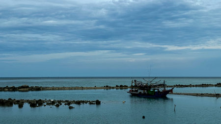 Fishing boat in the sea with cloudy sky background, Hua Thanon Beach in Koh Samui, Thailand