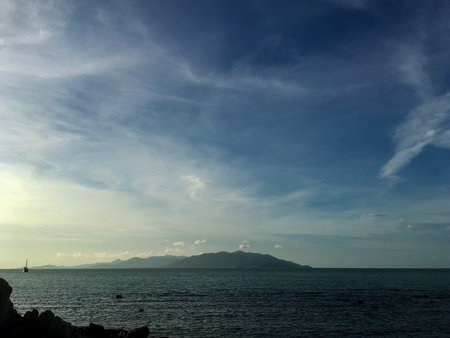 Beautiful seascape with blue sky, sea and mountain in the background at Naturism Beach, Koh Samui, Thailandの写真素材
