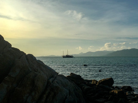 Sailing boat in the sea at sunset at Naturism Beach, Koh Samui, Thailand