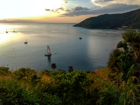Sailing boats on the sea at sunset, Windmill Viewpoint in Phuket, Thailand