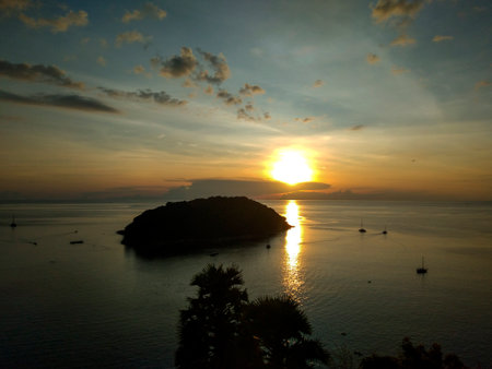 Sunset on the island of Phuket at Windmill Viewpoint in Phuket, Thailand