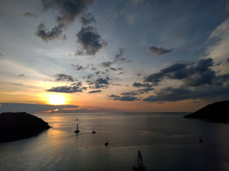 Beautiful sunset on the sea from Windmill Viewpoint in Phuket, Thailandの写真素材