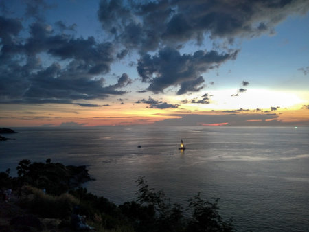 Sunset over the Andaman sea, the view from Windmill Viewpoint in Phuket, Thailandの写真素材
