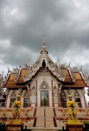 Thai temple in the raining cloudsの写真素材