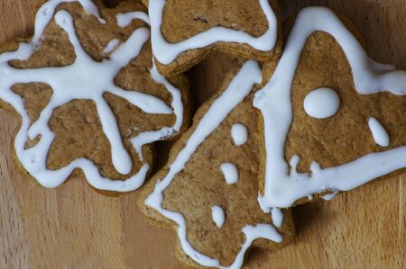 sweet gingerbread in different shapes with white stripes