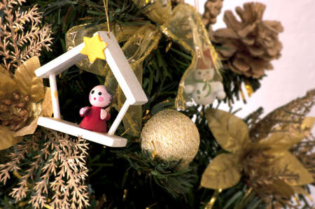 christmas tree decorated with wood toysの写真素材
