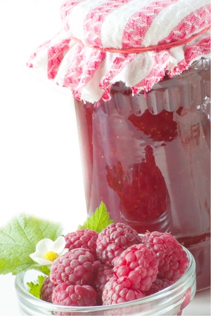 homemade raspberry jam with fruits beneathの写真素材