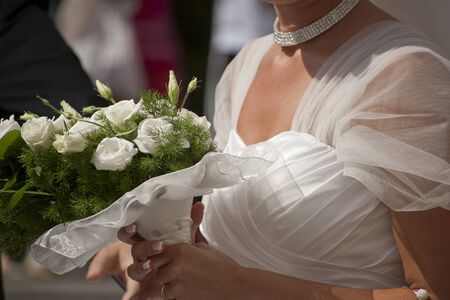 wedding scene with bride dress and bouquetの写真素材
