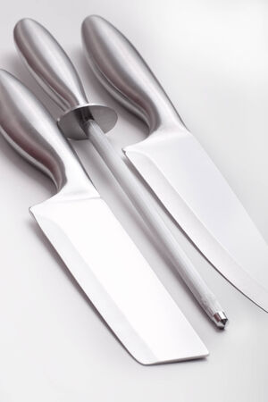 sharp kitchen instruments represented by metallic knivesの写真素材