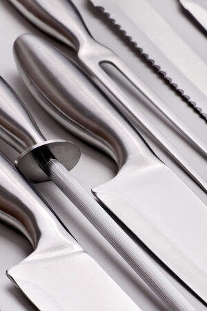 sharp kitchen instruments represented by metallic knivesの写真素材