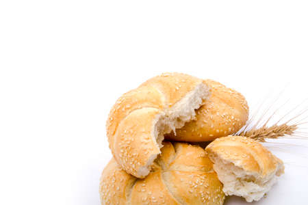 fresh baked golden bun on white backgroundの写真素材