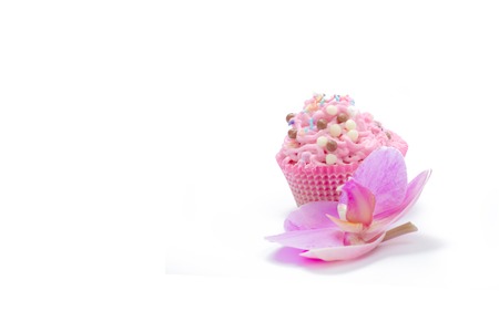 pink colored fresh muffins with different candiesの写真素材