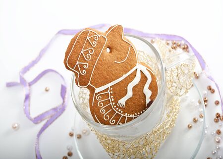homemade gingerbread figurine decorated with white sugarの写真素材