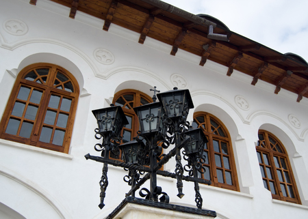 elegant iron lamp with byzantine style building in backgroundの写真素材
