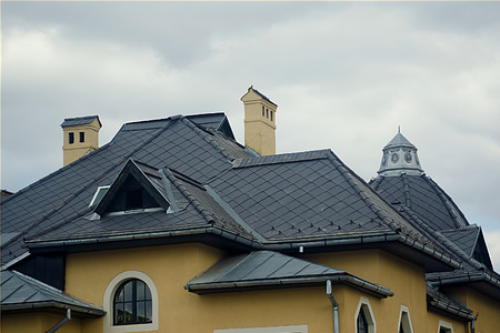 modern black tin roof with two chimneyの写真素材