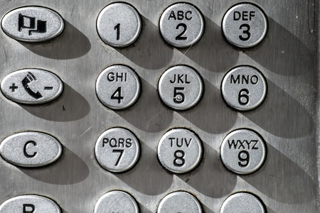 public phone specific keyboard metallic silver coloredの写真素材