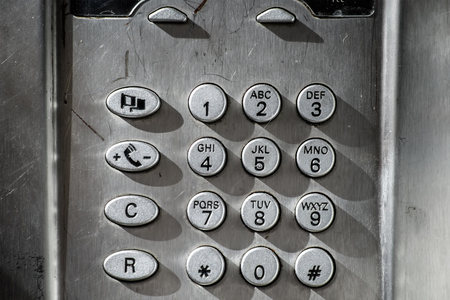 public phone specific keyboard metallic silver coloredの写真素材
