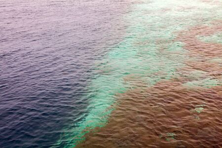Parasailing over clear tropical sea Maldives islandの写真素材
