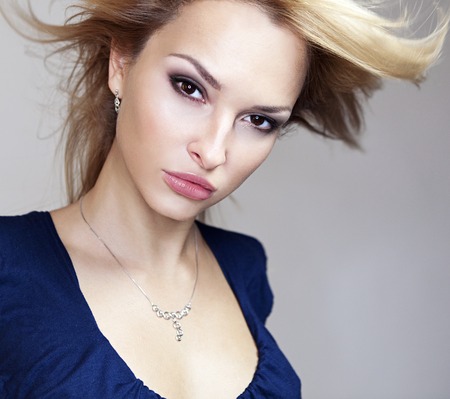 magnificent portrait of a beautiful young woman with perfect skin closeupの写真素材